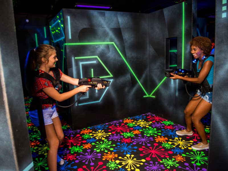 Girls playing laser tag