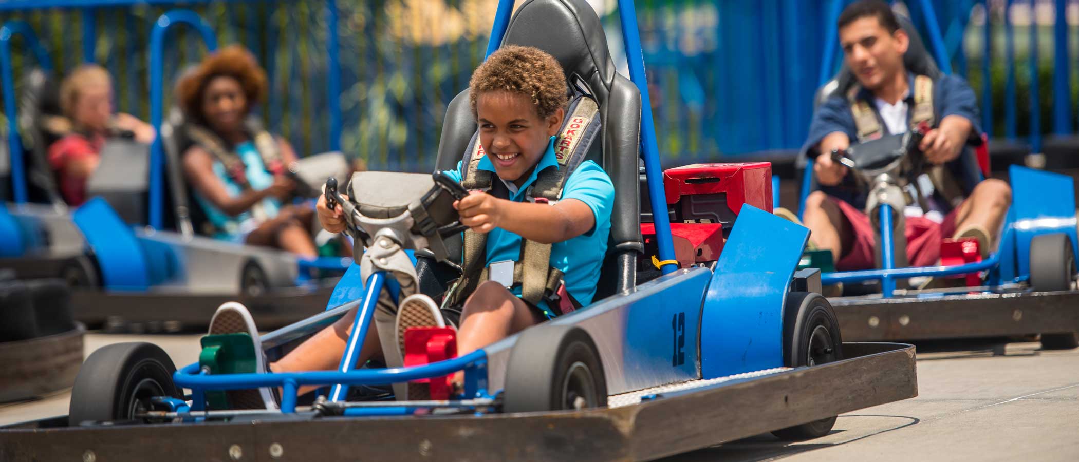 Kid driving a go-kart.